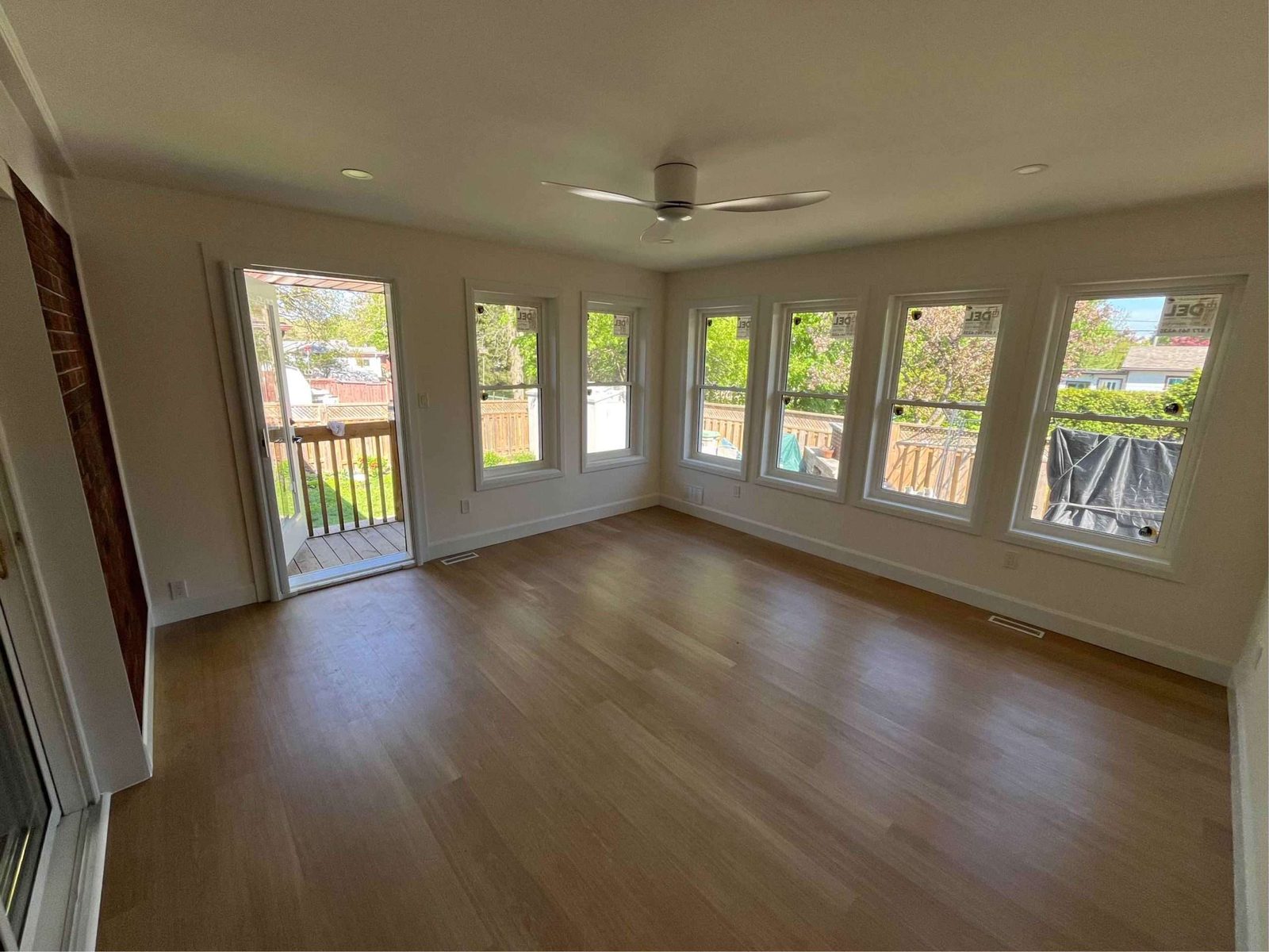 Bright sunroom addition with a wall of windows
