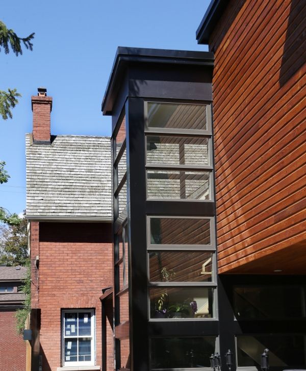 Cedar box addition with black-framed windows
